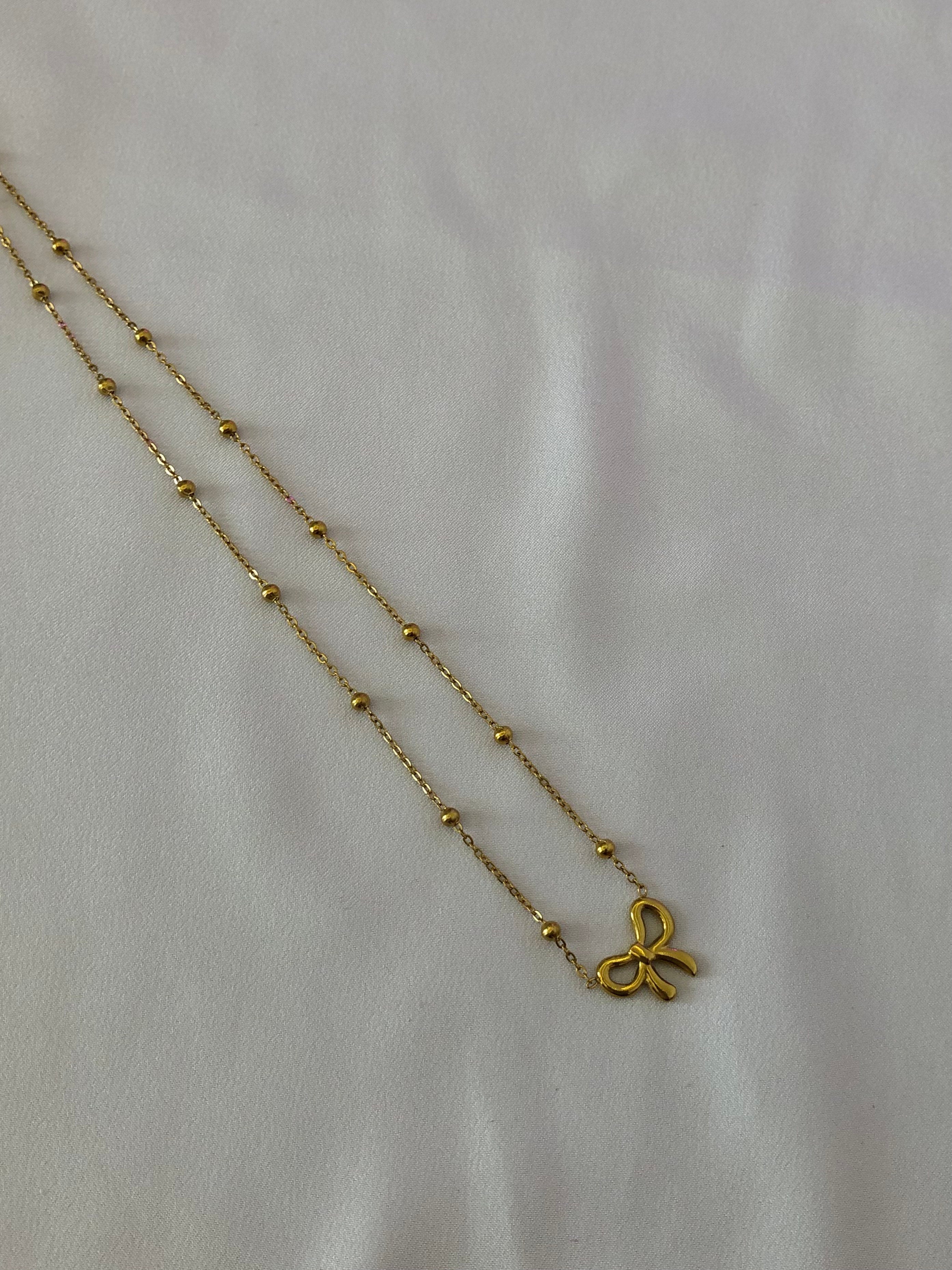 Stainless bow pendant